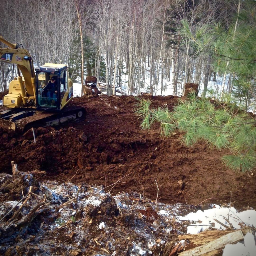 Excavator preparing An's home site